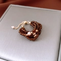 Detail of amber glass bead ring with pink pearls and adjustable gold-plated chain link - Ring-Gold-Coffee