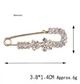 Spilla a cigno dorata con cristalli bianchi, misura 3,8x1,4 cm e peso di 6 g - Fiore a Croce