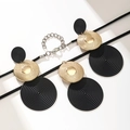 Fashion jewelry set with black spiral disks and gold textured accents on snake chains - Geometric Spiral Disc Style (Black Gold)