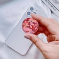 Collapsible round phone socket with vibrant red and pink geometric pattern on a white phone - Expanding Stand / Pink Holographic Round