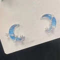 Elegant bow earrings featuring blue gradient crescent moon with cubic zirconia stars - Blue Gradient Constellation Moon