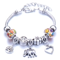 Silver beaded charm bracelet featuring elephant, tree of life, heart, and anchor pendants - Orange
