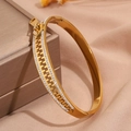 Detailed close-up of a gold zipper shaped stainless steel bracelet with sparkling zircons - Zipper Bracelet / Gold