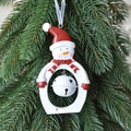 Christmas snowman hanging ornament with white metal bell and red scarf on tree branch - Snowman