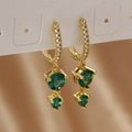 Macro detail of gold hoop earrings featuring green round zircon drops and white crystal pavé - Gold Green Zirconia