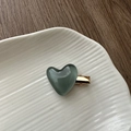 Close-up of a jelly blue heart hair clip on a white plate over a dark wooden background - Jelly Heart Hair Clip-Green