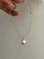 Close-up of a large white pearl pendant on a gold snake chain with adjustable clasp - Gold (Full Sterling Silver Edition)