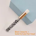 Close-up of portable eyelash cleanser brush with glitter black handle and gold flat head - Glitter Black