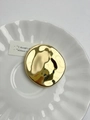 Macro detail of glossy golden irregular oval brooch on a white ceramic dish - 2 Irregular Round Gold (Y-193)