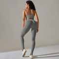 Close-up of ribbed seamless yoga set showing cross back bra and high waist leggings - Dark Gray