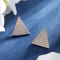 Triangle stud earrings with pave crystals in rose gold finish on a blue textured background - Triangle Pave Studs / Rose Gold