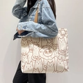 Minimalist cream canvas tote bag with brown cat print and dark brown woven straps - Simple Cat Line Drawing - Beige