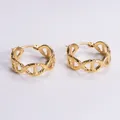 Macro view of gold hoop earrings with anchor chain design and hammered matte texture - Amleh019