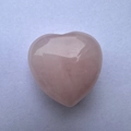 Macro shot of 3cm heart-shaped pink rose quartz stone with natural crystal textures - 3cm / Rose Quartz