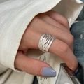 Minimalist silver multi-layer wrap ring worn on finger in a natural lifestyle setting - JZ1325 (Multi-layer Wrap)