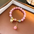 Pink cat's eye beaded bracelet with golden butterfly pendant and tassel detail - Pink Butterfly Style (54 Bracelet-Pink)