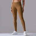 Detail view of the V-shaped high waistband on seamless ginger yoga leggings for women - Cocoa