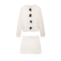 Elegant white knit two-piece set with black bow accents and fringe trim cardigan and skirt - Milky White / S