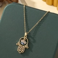 Gold Hamsa Hand necklace with Evil Eye pendant and white zircon on jewelry box - A4-Gold