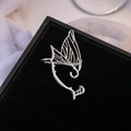 Silver butterfly wing cuff earring for women with minimalist fairy wing design on black velvet - Right Ear / Silver