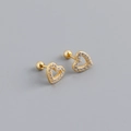 Close-up of heart-shaped gold stud earrings with cubic zirconia and screw-back closure - 925 Silver / Gold