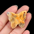 Polished butterfly carved natural agate stone pendant with yellow and orange swirls - Crazy Agate