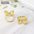 Adjustable golden butterfly ring featuring yellow crystal and zircon stone details - Yellow