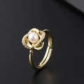Detailed macro view of a gold adjustable ring featuring a round white pearl and zircon accents - Intertwined Petal Artificial Pearl Style (A)