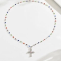 Multilayer silver necklace featuring colorful beads and a stone-set cross pendant - Silver Cross Color Stone