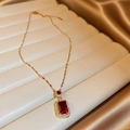 Elegant gold necklace featuring a rectangular red gemstone pendant with zircon halo - Red Necklace (Gold)