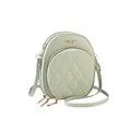Detail of light green round crossbody bag featuring quilted pockets and triple zippers - Green