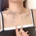 Elegant silver bow pendant necklace with metallic beads on model neck - Bowknot Round Bead Necklace (X3719) / Silver