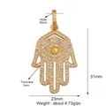 Detailed view of a gold-plated Hamsa Hand pendant with white zircon pavé and 31x23mm dimensions - M599142-gold / Gold