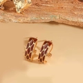 Golden earrings with leopard print enamel finish in a retro French hoop style - Coffee