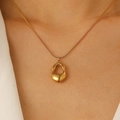French minimalist hollow teardrop necklace in golden finish worn on a model's neck - 18K Gold Plated Abstract Pendant Necklace (8869)