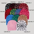 Flat lay of knit beanies with spider-man web jacquard patterns in thirteen colors - Capybara 203