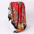 Close-up of red paisley silk scarf with floral patterns on a white pedestal - 90x90cm / Red (D9128)