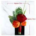 Groom's boutonniere with red and orange artificial roses on a black display stand - Red Orange Tea Bud Boutonniere