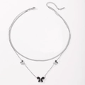 Detail view of double-layer stainless steel necklace featuring silver butterfly pendants - Steel Color Black Shell Butterfly Necklace