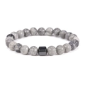 Macro detail of 8mm gray marble stone beads with a black metallic cylinder on the bracelet - Map