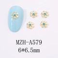 Bijoux d'ongles flocons dorés avec strass bleus, taille 6x6,5mm, modèle MZH-A579 - Style Flocon de Neige (A579)