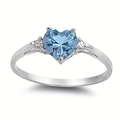 Minimalist silver heart ring featuring a light blue gemstone and side accent diamonds - Light Blue