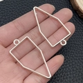 Silver geometric metal pendant frames in star and moon shapes on hand for DIY jewelry - Bullet Shape Bezel (22245) / 45x22mm / Bright Silver