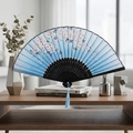 Blue foldable fan with cherry blossom pattern, black ribs and matching blue silk tassel - Style 69 (New Style)