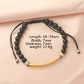 Detail view of black onyx beads bracelet with golden bar and size specifications - Black Agate + Gold Plate