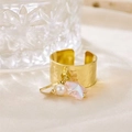 Detail of wide gold textured ring with hanging pearl and pink star charm on silk - R00904G (Hammered Wide Band + Pearl + Pink Star + Metal Bar)