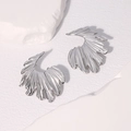 Silver fan-shaped pleated earrings in stainless steel on a white stone background - Steel