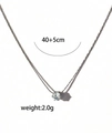 Detail view of dainty titanium steel necklace with clear zircon pendant and 40+5cm chain - Zircon Silver
