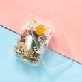 Flat lay detail of dried flower material box featuring gypsophila and colorful strawflowers - Misty White Tea