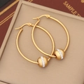 Close-up of golden hoop earrings featuring a sparkling rhinestone sphere on leather - Egg Shape (3#)